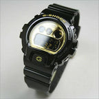 DW-6900CB Reloj G-Shock Hombre Resina Negro Dorado - Vista lateral