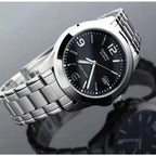 1215A Reloj Casio Hombre Correa de Acero Esfera Negra - Vista lateral